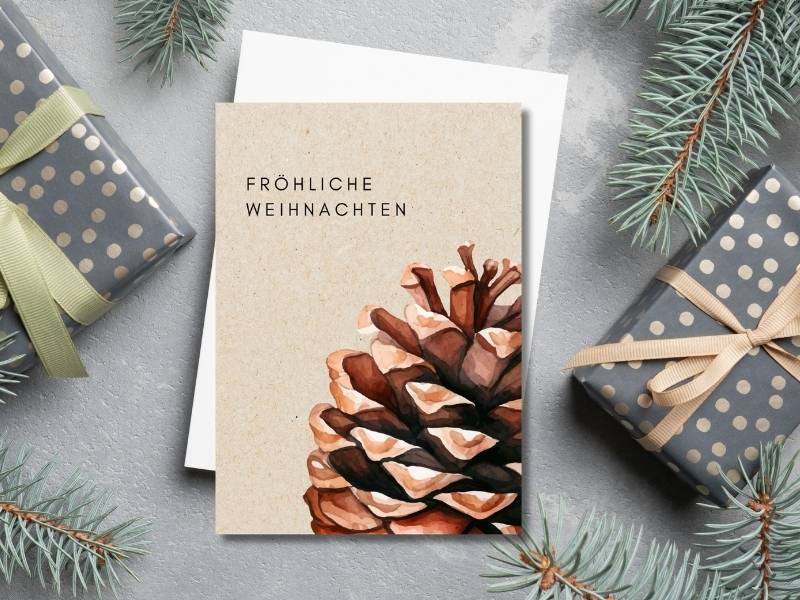 weihnachtskarten-grusskartenwelt-mockup-zapfen Weihnachtskarten grusskartenwelt Zapfen